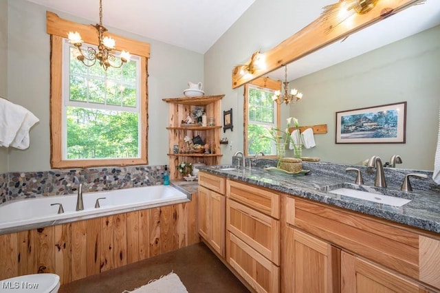 24416 Mountz Rd, Homeworth, OH 44634 - full bath featuring a chandelier, double vanity, a bath, and toilet