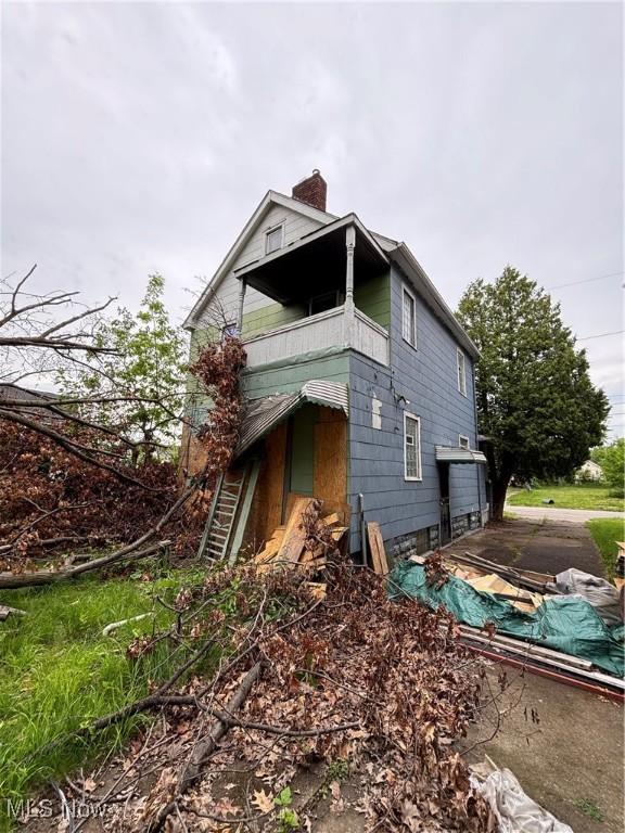 11226 Greenwich Ave, Cleveland, OH 44105 - view of home's exterior with a chimney