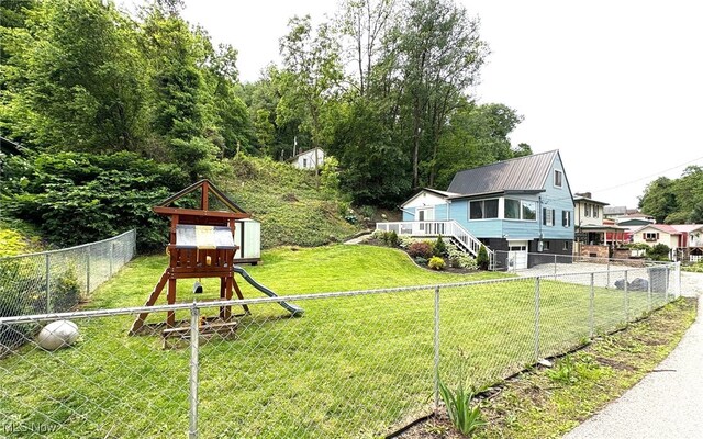 1720 Blosser Ln, Follansbee, WV 26037 - view of yard featuring a playground, a garage, and driveway