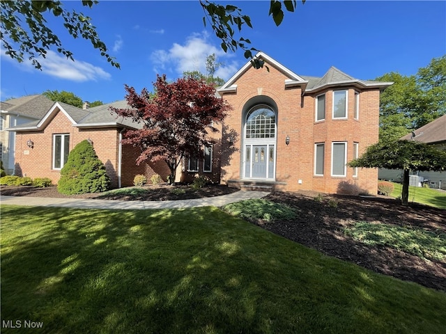 12701 Gordon St, North Royalton, OH 44133 - traditional-style house with brick siding and a front yard