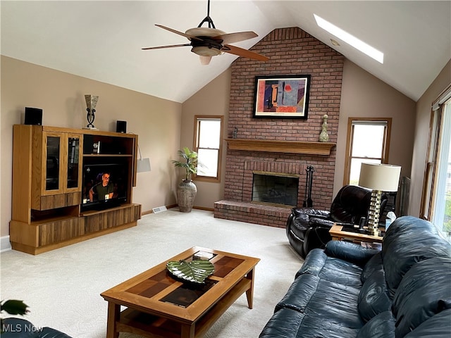12701 Gordon St, North Royalton, OH 44133 - living area featuring carpet flooring, a fireplace, lofted ceiling, a ceiling fan, and healthy amount of natural light