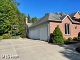 12701 Gordon St, North Royalton, OH 44133 - view of property exterior featuring driveway and a garage