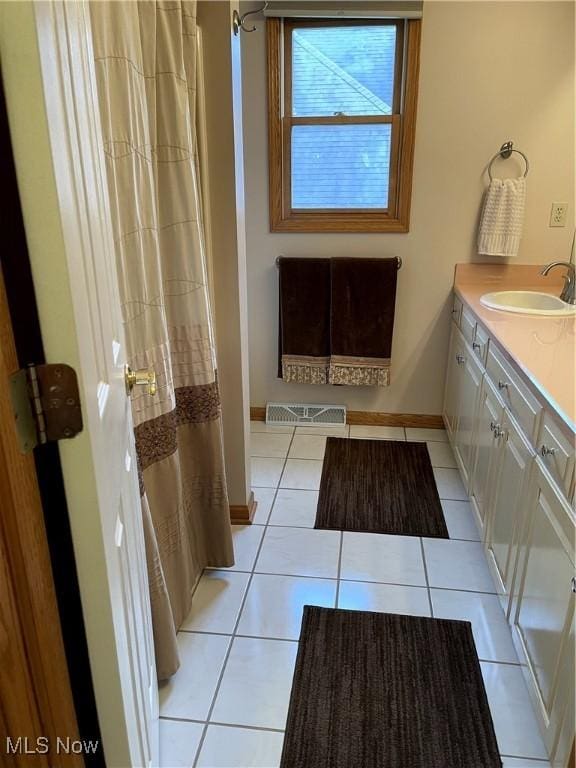 12701 Gordon St, North Royalton, OH 44133 - full bathroom with tile patterned flooring, vanity, and curtained shower