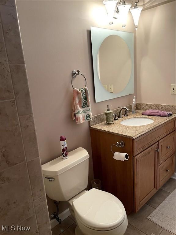12701 Gordon St, North Royalton, OH 44133 - half bathroom featuring tile patterned floors and vanity