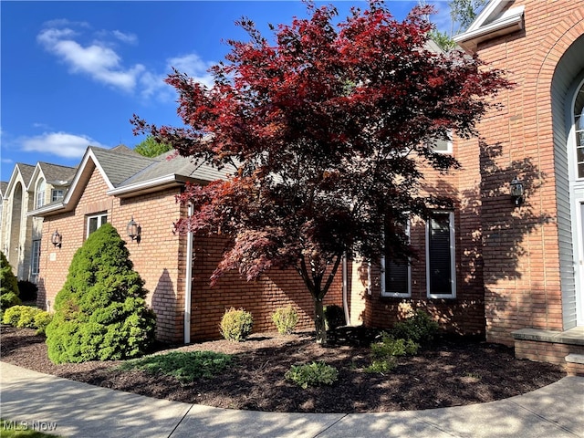 12701 Gordon St, North Royalton, OH 44133 - view of side of home with brick siding and a shingled roof