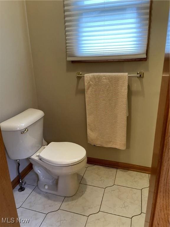 12701 Gordon St, North Royalton, OH 44133 - bathroom with toilet and baseboards