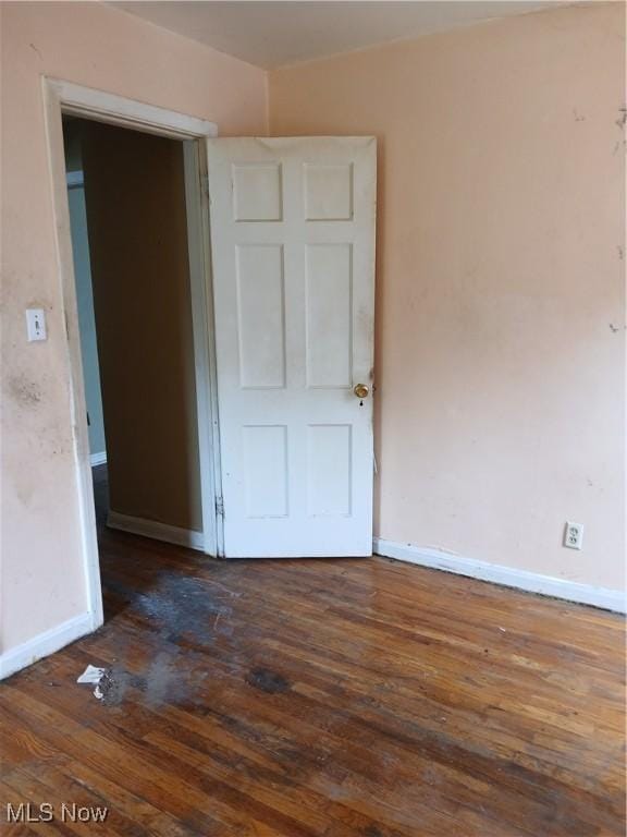 230 E 211th St, Euclid, OH 44123 - spare room with dark wood finished floors and baseboards
