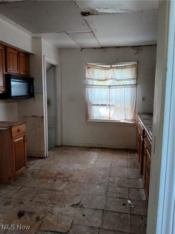 230 E 211th St, Euclid, OH 44123 - kitchen featuring brown cabinetry