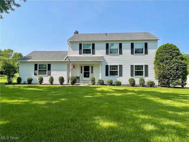 180 Atterbury Blvd, Hudson, OH 44236 - colonial inspired home featuring a front lawn, a chimney, and roof with shingles