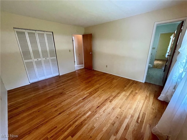 180 Atterbury Blvd, Hudson, OH 44236 - unfurnished bedroom with wood finished floors and a closet