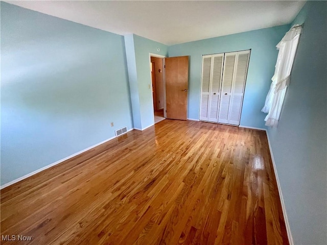180 Atterbury Blvd, Hudson, OH 44236 - unfurnished bedroom with wood finished floors, a closet, and baseboards