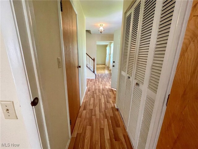 180 Atterbury Blvd, Hudson, OH 44236 - hall with wood finished floors, an upstairs landing, and baseboards