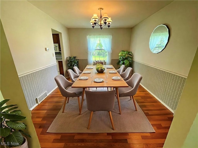 180 Atterbury Blvd, Hudson, OH 44236 - dining space with a wainscoted wall, a chandelier, wallpapered walls, and wood finished floors