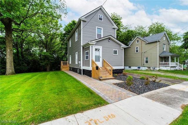 90 Frank St, Struthers, OH 44471 - view of front of house featuring a front yard and entry steps