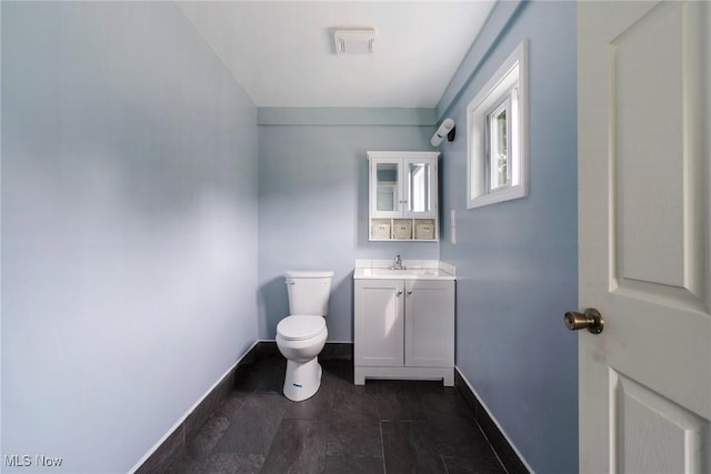 90 Frank St, Struthers, OH 44471 - half bathroom with toilet, baseboards, and vanity