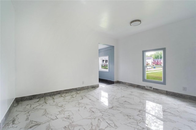 90 Frank St, Struthers, OH 44471 - unfurnished room with healthy amount of natural light and baseboards