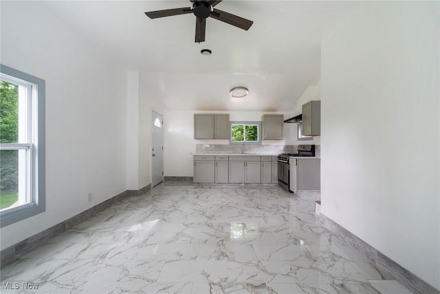 90 Frank St, Struthers, OH 44471 - kitchen with stainless steel range with gas cooktop, gray cabinets, healthy amount of natural light, and baseboards