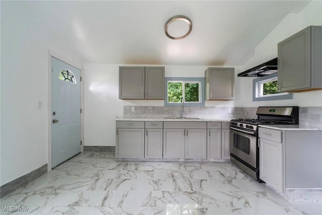 90 Frank St, Struthers, OH 44471 - kitchen with stainless steel gas stove, a sink, gray cabinetry, and healthy amount of natural light