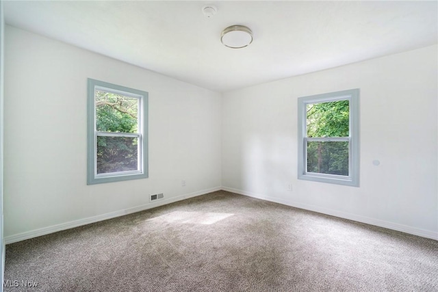 90 Frank St, Struthers, OH 44471 - empty room featuring carpet floors and baseboards