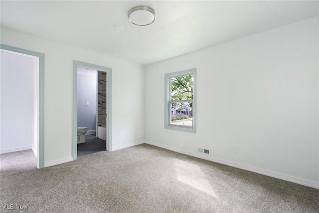 90 Frank St, Struthers, OH 44471 - unfurnished bedroom with carpet, baseboards, and ensuite bathroom