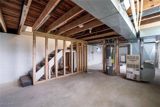 90 Frank St, Struthers, OH 44471 - unfinished basement with gas water heater, heating unit, and stairway