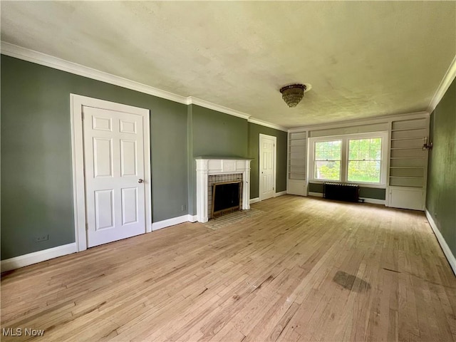 31 Indiana Ave, Youngstown, OH 44505 - unfurnished living room featuring light wood-type flooring, ornamental molding, a fireplace with flush hearth, and baseboards