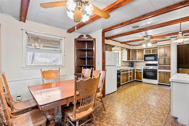 12873 Unity Rd, New Springfield, OH 44443 - dining room with ceiling fan, beamed ceiling, and light flooring