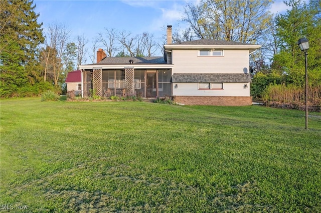 12873 Unity Rd, New Springfield, OH 44443 - back of house featuring a sunroom, a chimney, and a lawn