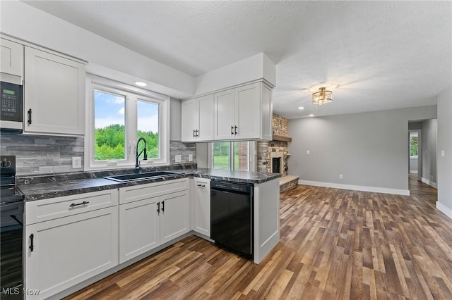 3371 Padanarum Rd, Geneva, OH 44041 - kitchen with black appliances, a sink, dark countertops, decorative backsplash, and recessed lighting