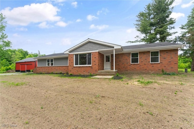 3371 Padanarum Rd, Geneva, OH 44041 - ranch-style home featuring brick siding and a detached garage