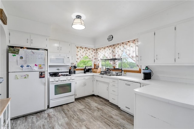 525 Hill Blvd, East Liverpool, OH 43920 - kitchen featuring white appliances, light countertops, a sink, and white cabinetry