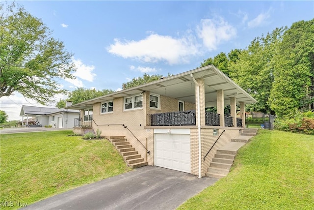 525 Hill Blvd, East Liverpool, OH 43920 - view of front of property with stairs, brick siding, a front yard, and driveway