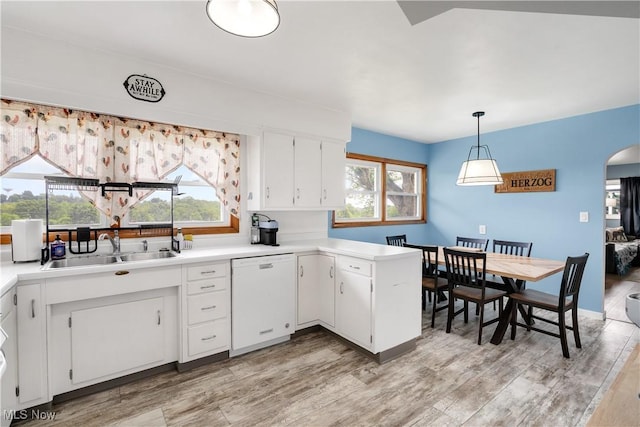525 Hill Blvd, East Liverpool, OH 43920 - kitchen featuring white dishwasher, a sink, white cabinetry, and light wood-type flooring