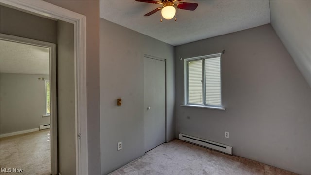 62253 Forestview Dr, Cambridge, OH 43725 - unfurnished bedroom featuring a baseboard radiator, light colored carpet, and a closet