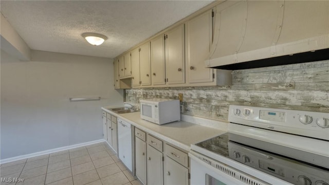 62253 Forestview Dr, Cambridge, OH 43725 - kitchen featuring white appliances, a textured ceiling, light countertops, baseboards, and light tile patterned flooring