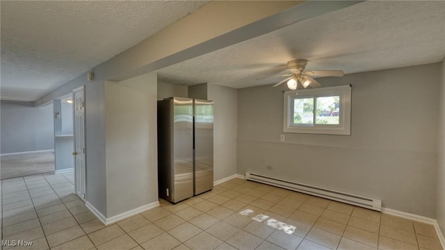 62253 Forestview Dr, Cambridge, OH 43725 - unfurnished room featuring baseboard heating, a textured ceiling, light tile patterned flooring, ceiling fan, and baseboards