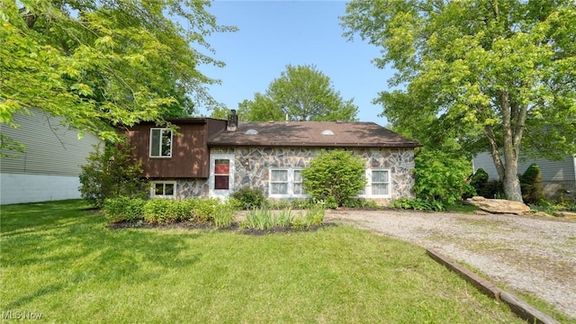 62253 Forestview Dr, Cambridge, OH 43725 - view of front of property with stone siding, a front yard, and a chimney