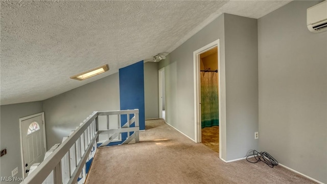 62253 Forestview Dr, Cambridge, OH 43725 - hallway with a wall mounted air conditioner, a textured ceiling, carpet floors, an upstairs landing, and baseboards