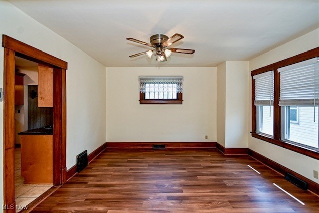 837 Lake Ave NE, Massillon, OH 44646 - spare room with wood finished floors, baseboards, and ceiling fan