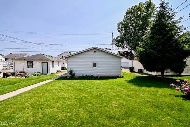 837 Lake Ave NE, Massillon, OH 44646 - view of property exterior featuring a lawn