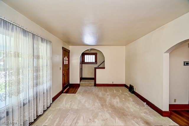 837 Lake Ave NE, Massillon, OH 44646 - foyer with arched walkways, carpet, and baseboards