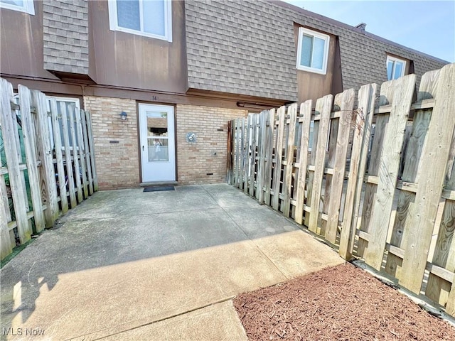 6400 Center St Unit 14, Mentor, OH 44060 - view of exterior entry with brick siding, mansard roof, and roof with shingles