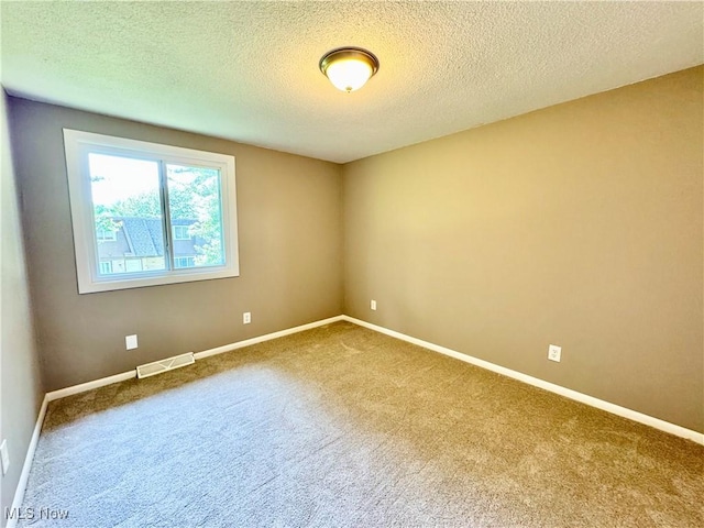 6400 Center St Unit 14, Mentor, OH 44060 - unfurnished room with carpet, a textured ceiling, and baseboards