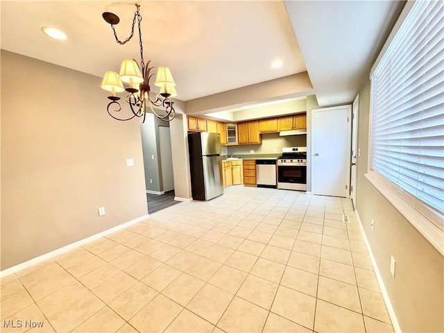 6400 Center St Unit 14, Mentor, OH 44060 - kitchen with stainless steel appliances, a chandelier, light tile patterned floors, baseboards, and recessed lighting