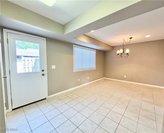 6400 Center St Unit 14, Mentor, OH 44060 - foyer with light tile patterned floors, baseboards, and a chandelier