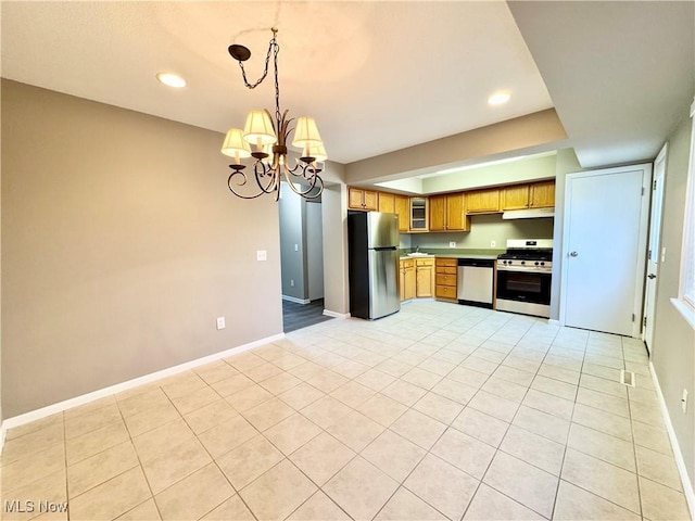 6400 Center St Unit 14, Mentor, OH 44060 - kitchen with stainless steel appliances, light tile patterned floors, under cabinet range hood, baseboards, and recessed lighting