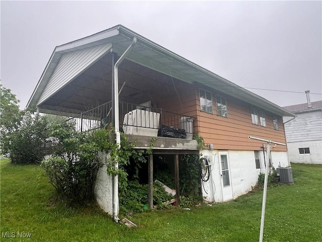 156 Andover Rd, Woodsfield, OH 43793 - rear view of property with central air condition unit and a yard