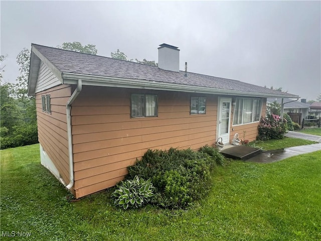 156 Andover Rd, Woodsfield, OH 43793 - back of property with a yard, a chimney, and roof with shingles