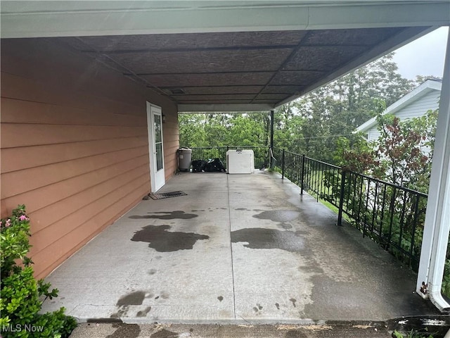 156 Andover Rd, Woodsfield, OH 43793 - view of patio featuring a carport