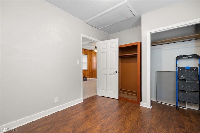 348 Elberta Dr, Vermilion, OH 44089 - unfurnished bedroom featuring attic access, wood finished floors, and baseboards